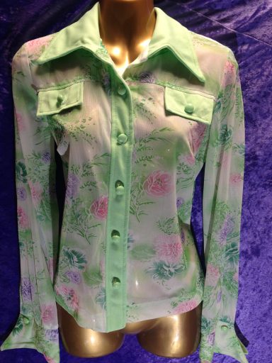 Green floral patterned shirt with a button-up front and long sleeves.